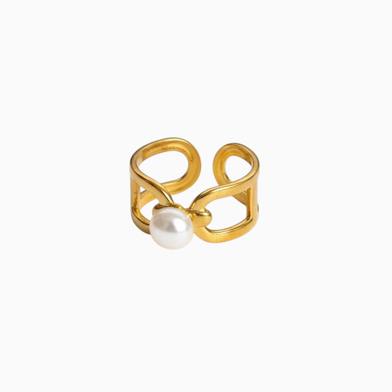 Anel largo GRINE em aço inoxidável dourado com pérola central e design ajustável de estilo minimalista.