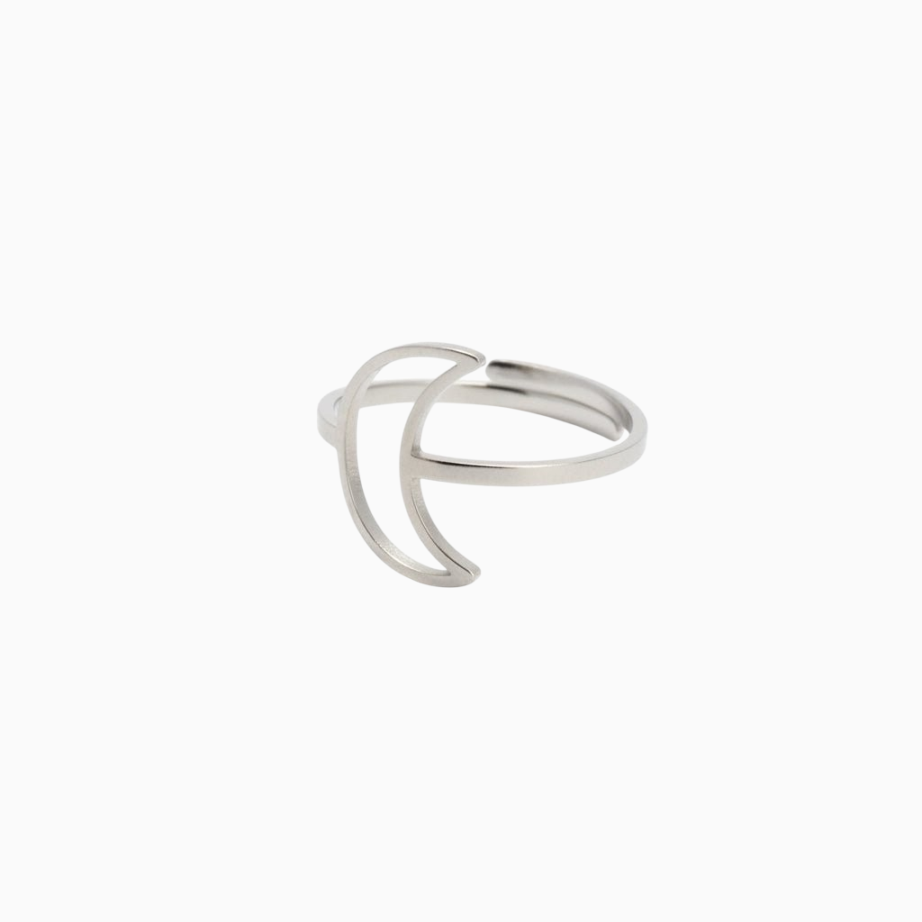 Anel GRINE minimalista em aço inoxidável prateado com design delicado de lua crescente sobre fundo branco