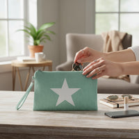 GRINE Aquamarine textile pouch with white star detail and removable wrist strap, perfect for beach essentials.