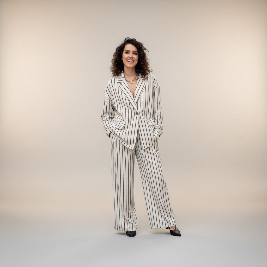 GRINE beige linen blend oversized blazer with black pinstripes, paired with matching wide-leg trousers.