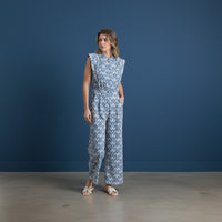 GRINE blue patterned wide-leg jumpsuit with side pockets and elasticated back waist. Sleeveless with a collared neckline.