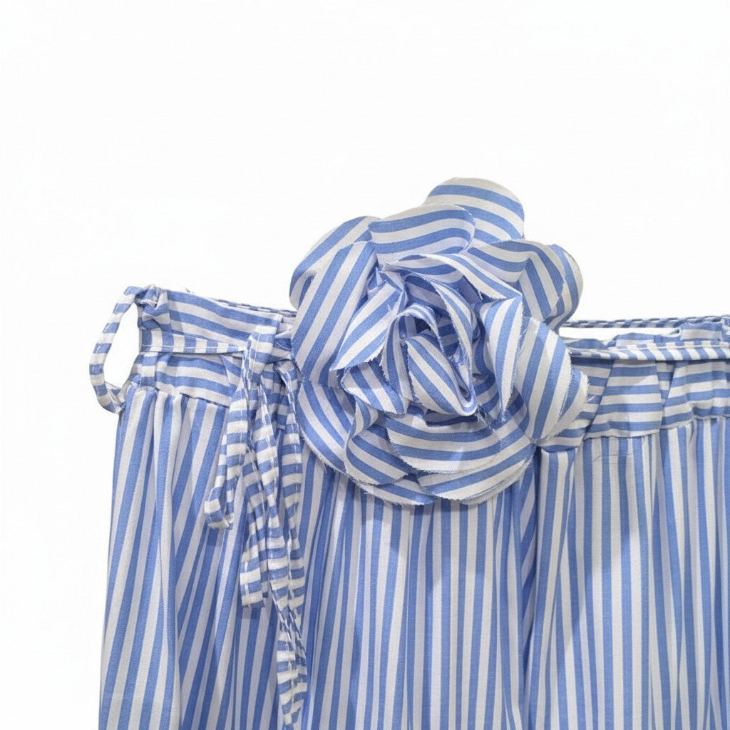 GRINE blue and white striped maxi skirt with elastic waist, decorative tie belt, and a large fabric flower accent.