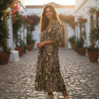 GRINE Bora Bora midi dress in green with ikat print, round neck, 3 buttons, and long sleeves. 100% polyester.