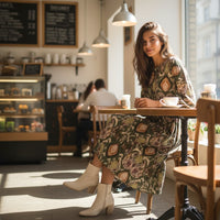 GRINE Bora Bora midi dress in green with ikat print, round neck, 3 buttons, and long sleeves. 100% polyester.