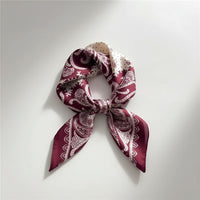 GRINE square satin scarf in bordeaux with paisley print. 100% polyester, 70cm x 70cm.