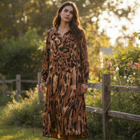 GRINE long brown and black animal print viscose shirt dress with button front and collared neckline.