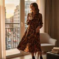 GRINE long brown and black animal print viscose shirt dress with button front and collar.
