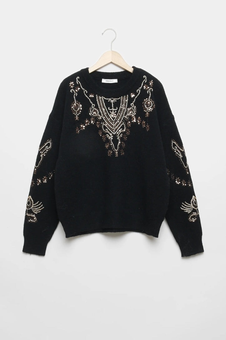 Camisola de malha preta GRINE com gola redonda, manga comprida e detalhes decorativos em lantejoulas brilhantes.