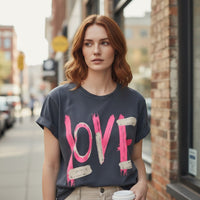 GRINE charcoal grey cotton t-shirt with pink and beige 'LOVE' graphic print, short sleeves, and rolled cuffs.
