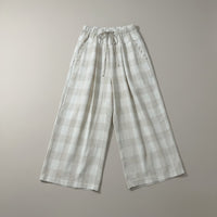 GRINE Claire beige checkered linen wide-leg pants with drawstring waist and scalloped pocket details.