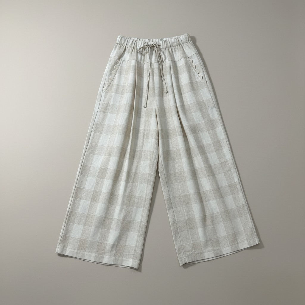 GRINE Claire beige checkered linen wide-leg pants with drawstring waist and scalloped pocket details.