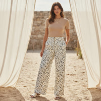 GRINE mustard yellow and olive green floral print straight leg jeans with adjustable elastic waist and pockets.