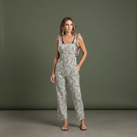 GRINE green floral print overalls with ruffled straps and straight leg cut. Casual and versatile.