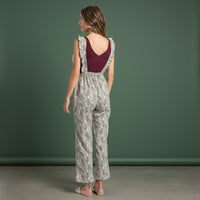 GRINE green floral print wide-leg overalls with ruffled straps and elastic waist. Casual style.