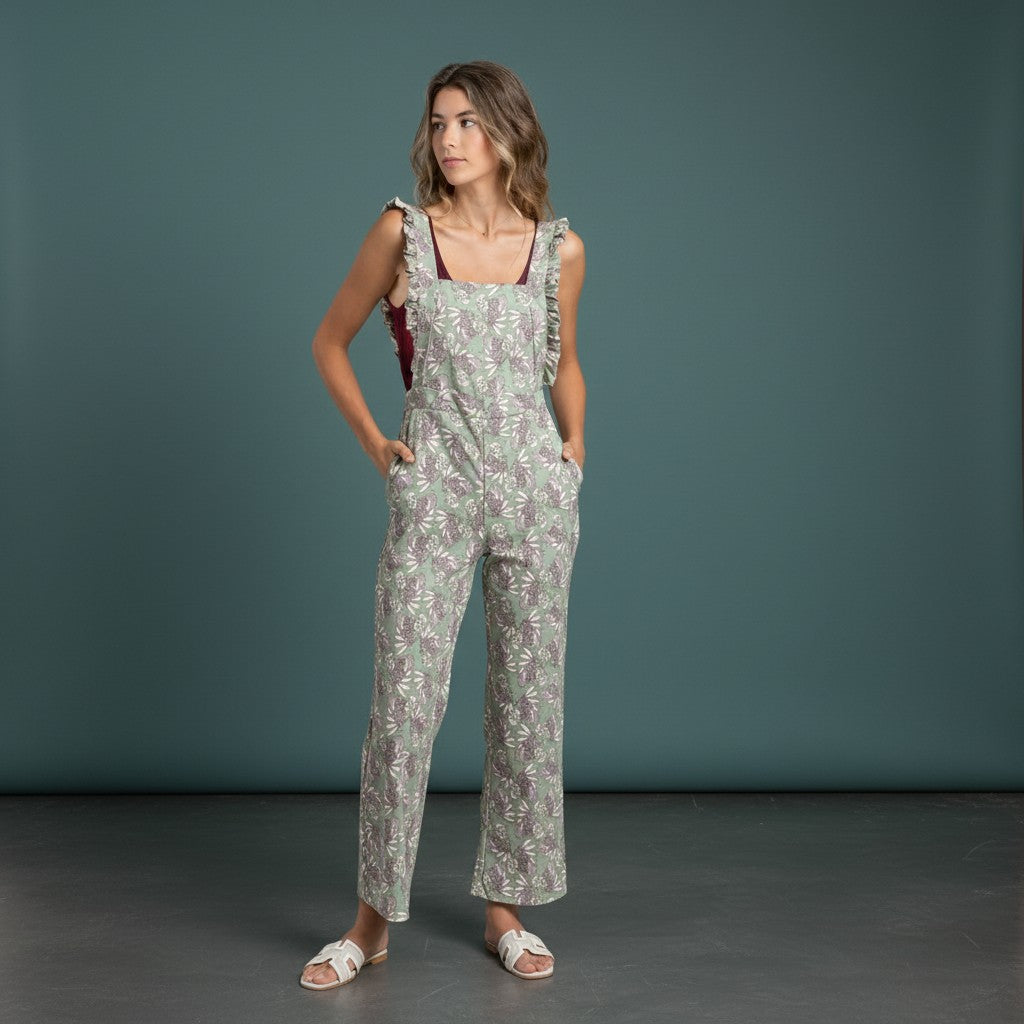 GRINE green floral print straight leg overalls with ruffled straps and side pockets.