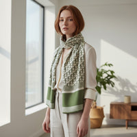 GRINE green and white monogram print polyester scarf, 195cm x 90cm.