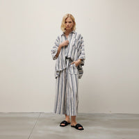 GRINE grey striped wide-leg pants with elastic waist and two side pockets, made of rayon, polyester, and cotton blend.