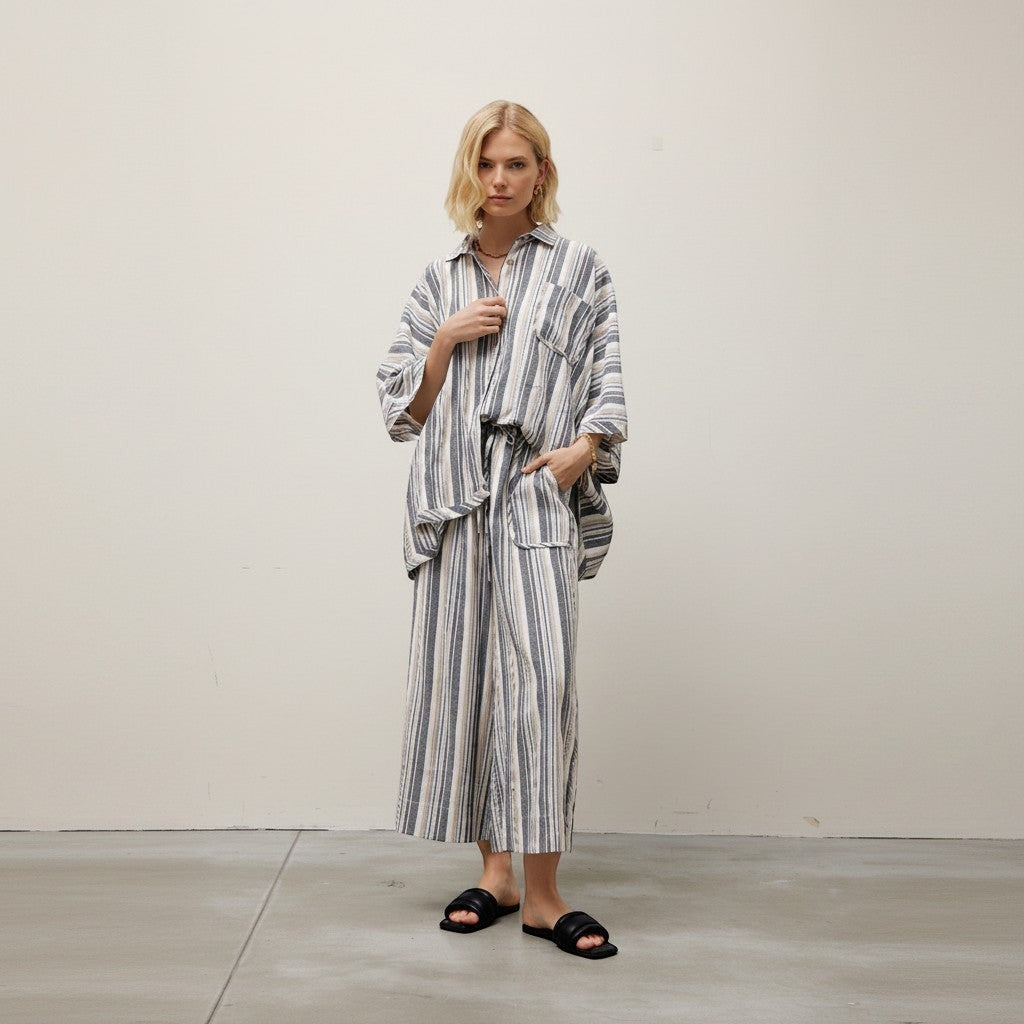 GRINE grey striped wide-leg pants with elastic waist and two side pockets, made of rayon, polyester, and cotton blend.