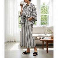 GRINE wide-leg grey striped trousers with elasticated waist and two side pockets, made from a rayon, polyester, and cotton blend.