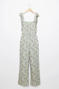 Jardineiras GRINE verdes com estampado floral, corte direito, alças com folhos e cintura ajustada.
