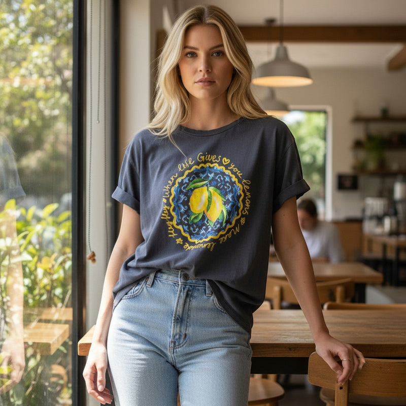 GRINE dark grey cotton t-shirt with short sleeves and a relaxed fit, featuring a yellow graphic print of lemons and the phrase "life gives you lemons make lemonade".