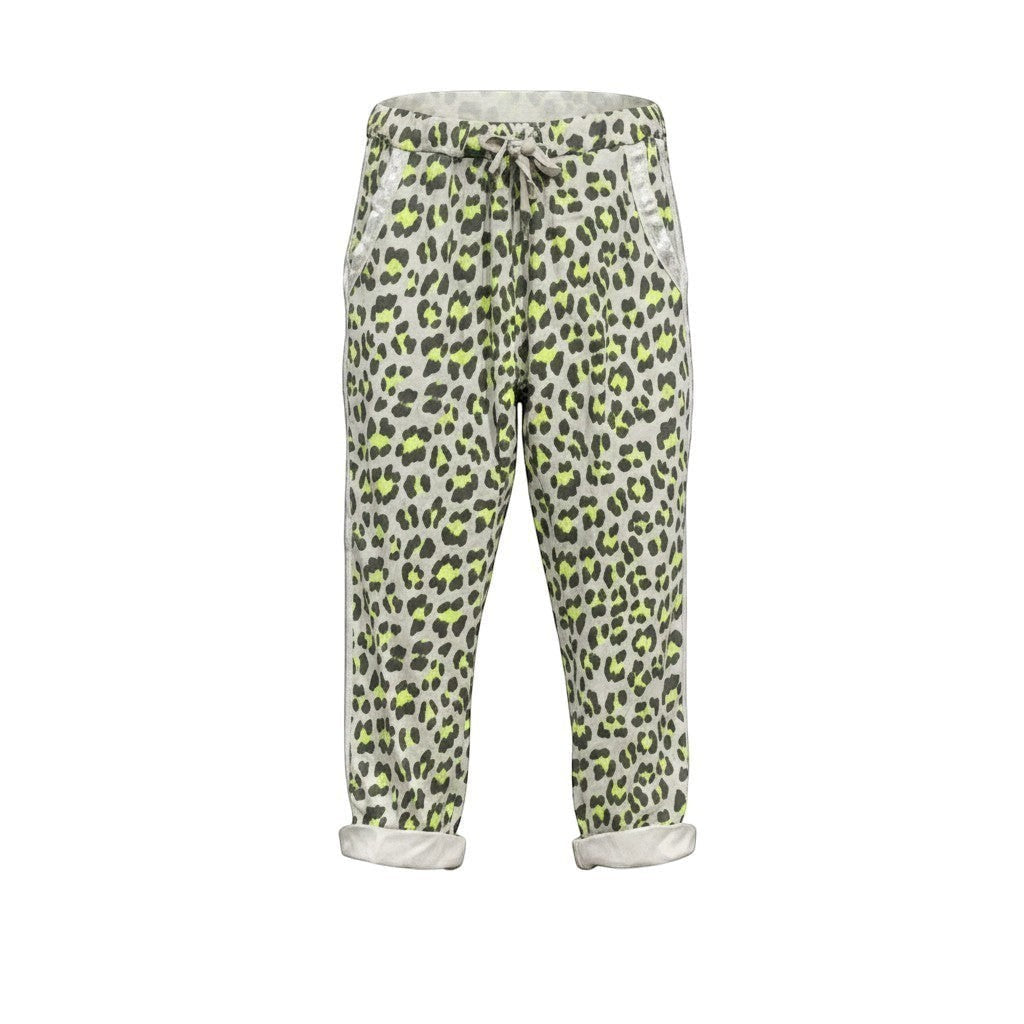 GRINE leopard print jogger pants with lime green accents, elastic waist, and cuffed hem. Cotton blend.