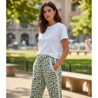GRINE leopard print jogger pants with elastic waist and drawstring, featuring neon yellow and grey pattern.
