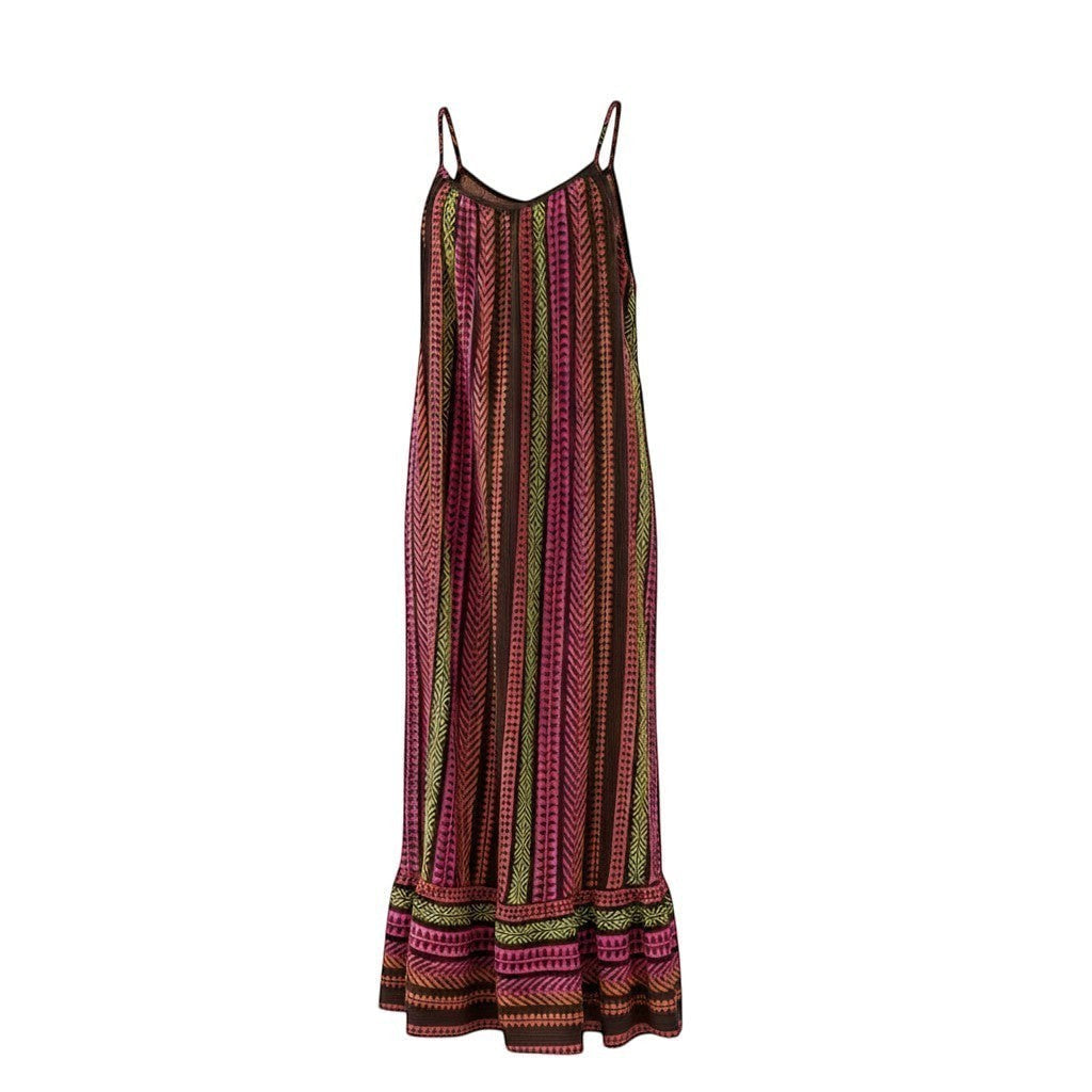 GRINE Anita long flowing cotton dress with multicolor ethnic pattern in pink, orange, brown, and green. Features thin straps and a ruffled hem.