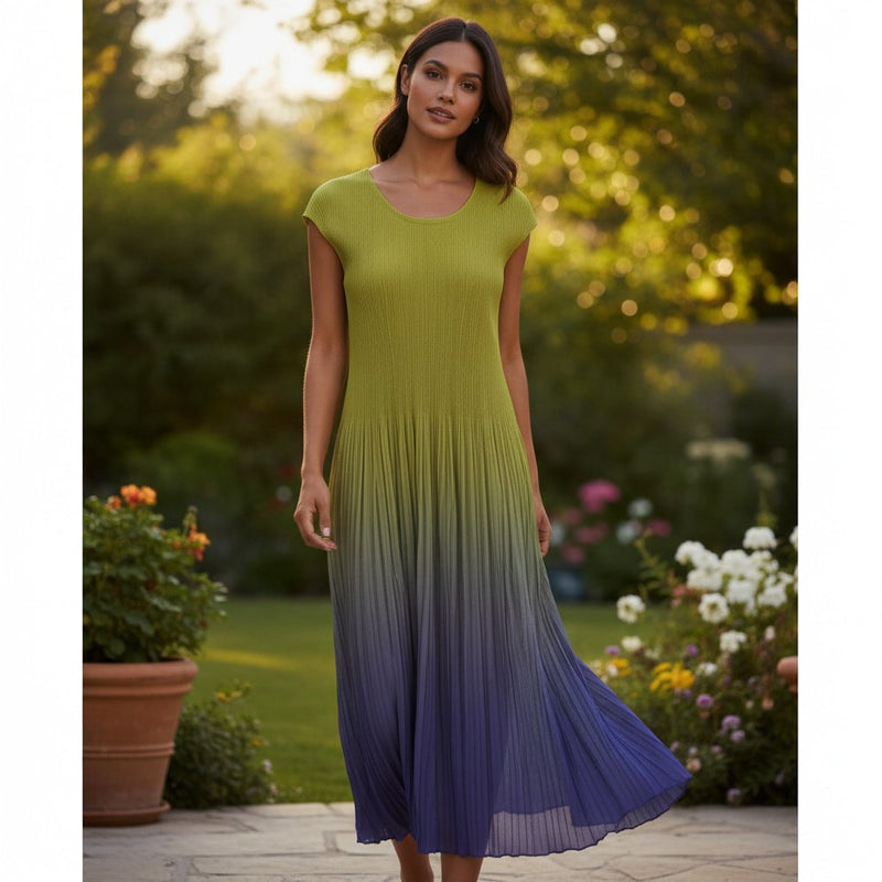 GRINE long pleated dress with a yellow to purple gradient effect, sleeveless with a slightly structured shoulder.