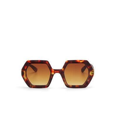 Óculos de sol GRINE OKKIA EMMA com armação hexagonal em padrão tartaruga e lentes castanhas degradé polarizadas.
