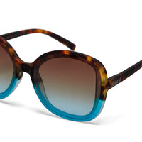 Óculos de sol GRINE OKKIA ANNA com armação tartaruga e detalhes em azul, lentes castanhas degradé e proteção UV400.