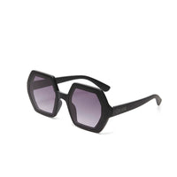 Óculos de sol GRINE OKKIA EMMA com armação preta em acetato e lentes geométricas polarizadas com proteção UV400.