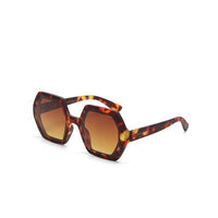 Óculos de sol GRINE OKKIA EMMA com armação em acetato padrão tartaruga Classic Havana e lentes castanhas degradé.