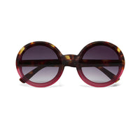 Óculos de sol GRINE OKKIA Monica redondos com armação em acetato tartaruga e rosa e lentes castanhas polarizadas.