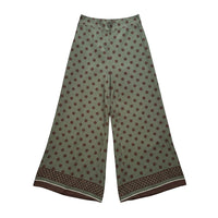 GRINE olive green wide-leg trousers with brown polka dots and a decorative border at the hem. Lightweight cotton, ideal for warm weather.