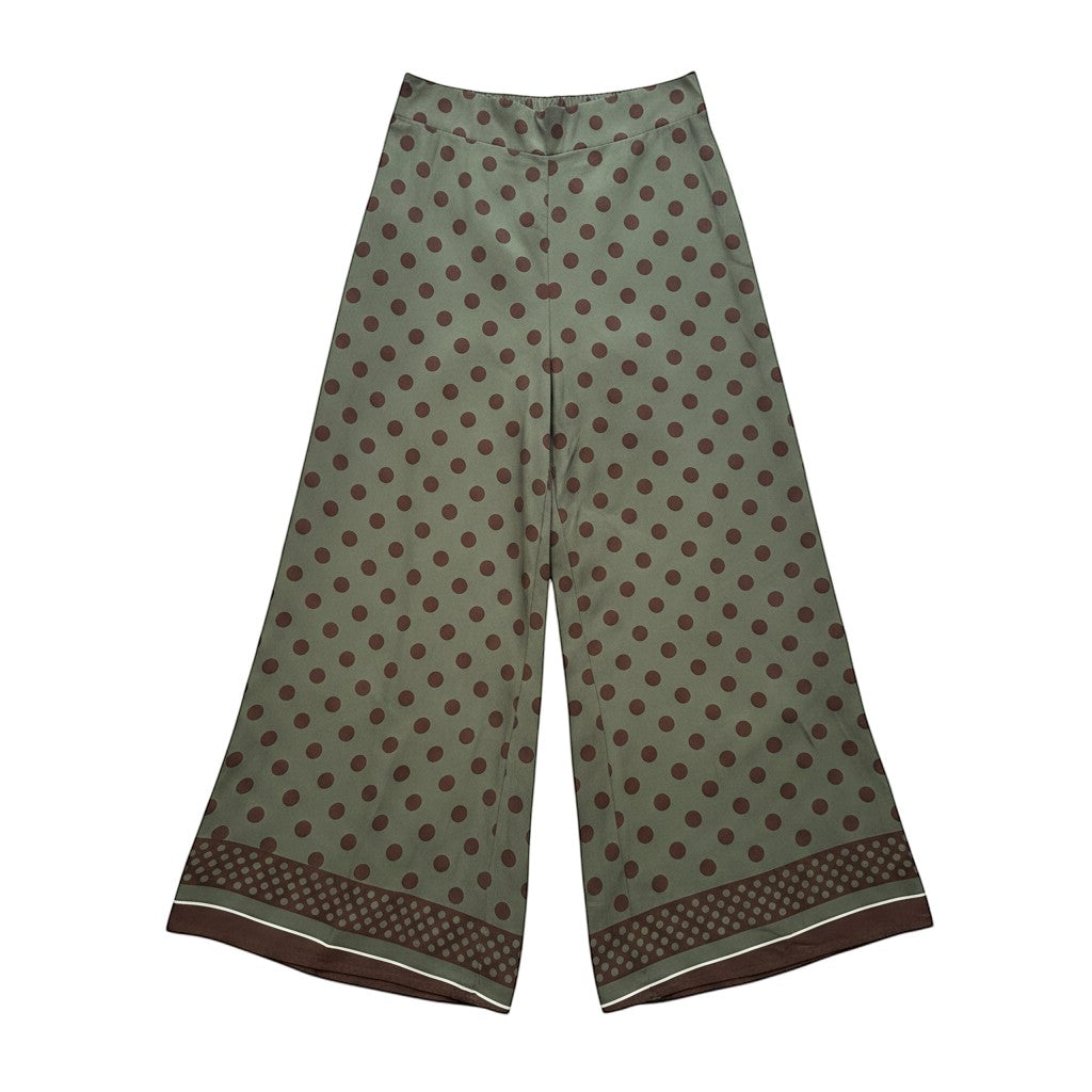 GRINE olive green wide-leg trousers with brown polka dots and a decorative border at the hem. Lightweight cotton, ideal for warm weather.