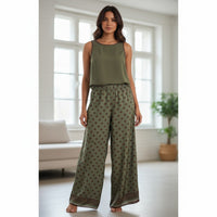 GRINE olive green wide-leg trousers with brown polka dots and a decorative border at the hem. Lightweight cotton, ideal for warm weather.