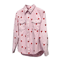 GRINE pink denim shirt jacket with red embroidered hearts, featuring two chest pockets and a button-up front.