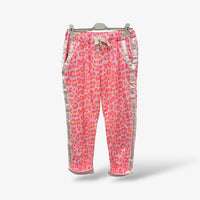 GRINE pink and orange leopard print jogger pants with elastic waistband and side stripes. Cotton blend.