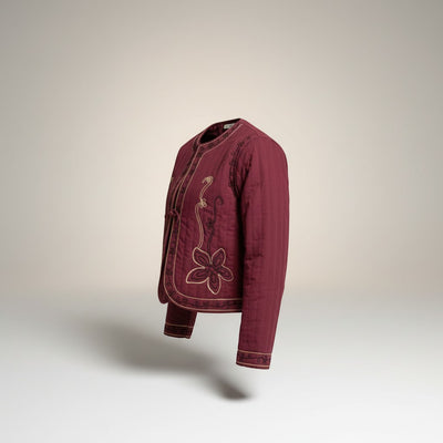 GRINE plum quilted jacket with floral embroidery and tie front closure. Short, lined, and sleeveless.