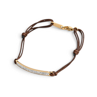 Pulseira GRINE ajustável em aço inoxidável dourado com barra curva cravejada de brilhantes e cordão castanho