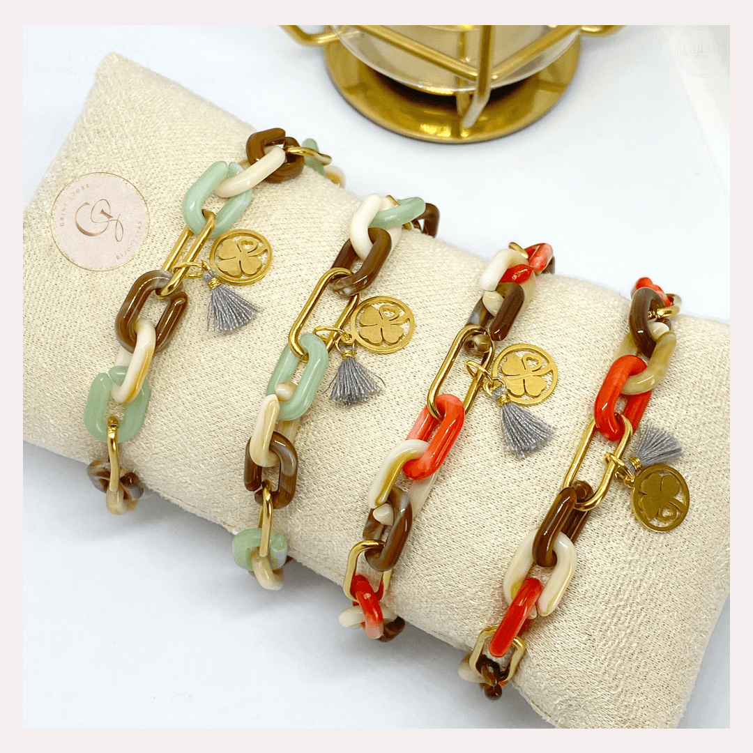 Pulseiras GRINE em aço inoxidável com elos de acrílico coloridos, medalha de trevo e pendente de borla