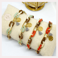 Pulseiras GRINE em aço inoxidável com elos de acrílico coloridos, medalha de trevo e pendente de borla