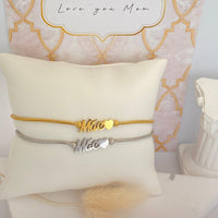 Pulseiras ajustáveis GRINE em aço inoxidável com a palavra Mãe e detalhe de coração em tons dourado e prateado