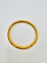 Pulseira GRINE artesanal budista em tom dourado com folha de ouro e conector gravado, símbolo de sorte e proteção.