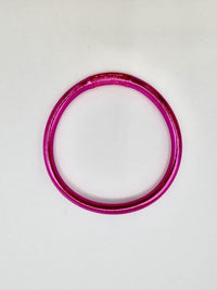 Pulseira GRINE artesanal budista em tom fúcsia brilhante com folha de ouro, flexível e impermeável.
