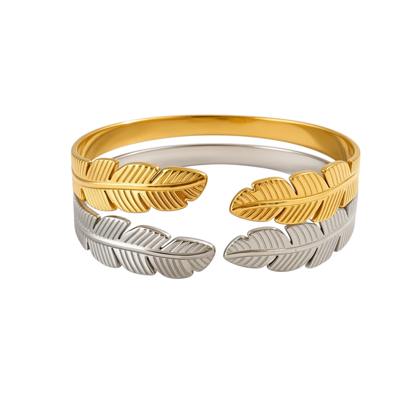 Pulseira GRINE Leaves em aço inoxidável com design de folhas, disponível em tons dourado e prateado, ajustável.