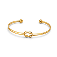 Pulseira GRINE de nó duplo em aço inoxidável dourado com design ajustável e acabamento polido