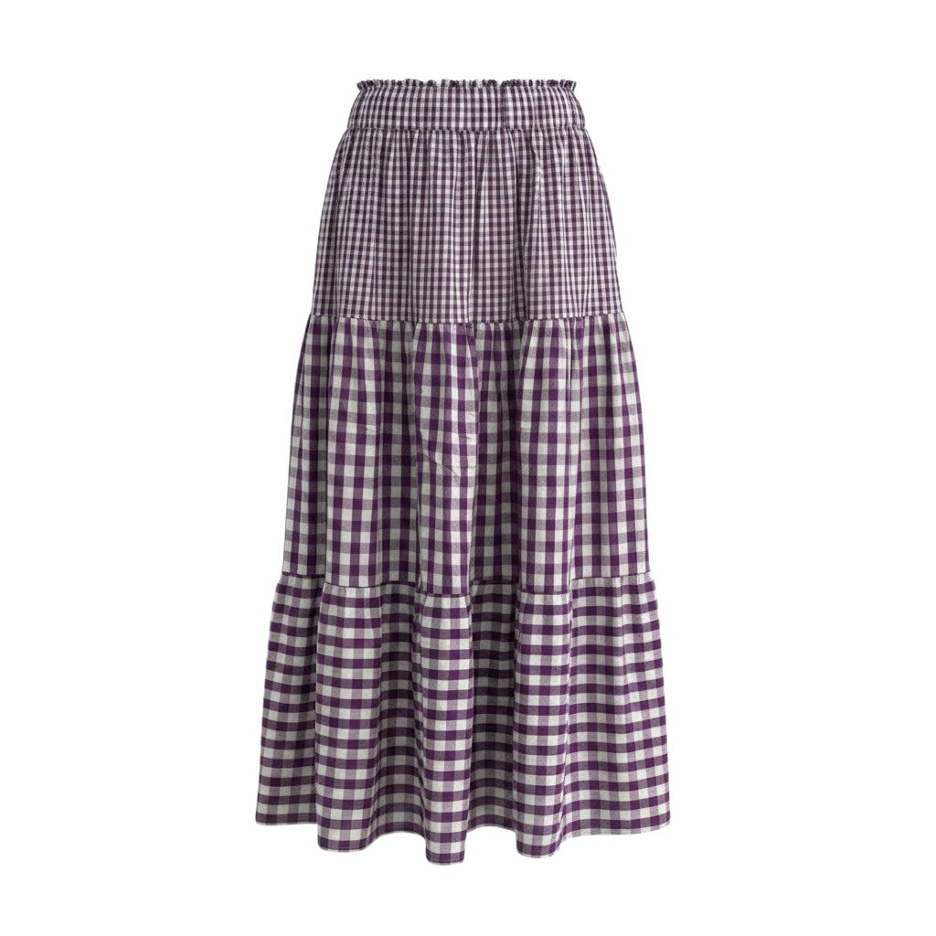 Saia midi GRINE em padrão vichy roxo e branco, com cintura elástica e folhos em camadas.