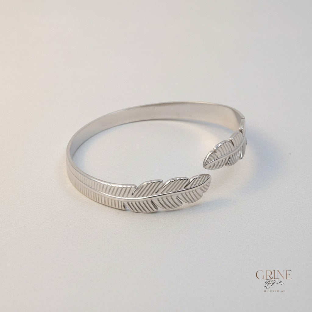 GRINE silver stainless steel cuff bracelet with delicate leaf design, adjustable and hypoallergenic.